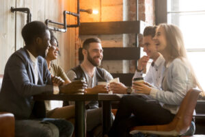 group of friends chatting in a coffee shop